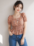 Flora Smocked Peplum Top
